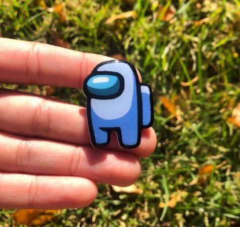 This Among Us pin and many others are available for $5 on Wilburst Pins Etsy!