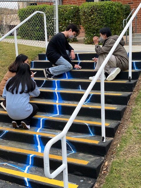 Joseph Mercado, Joanna Castro, Leslie Sanchez, and Broch Gillies are in the middle of completing their designs on one of the stair cases.