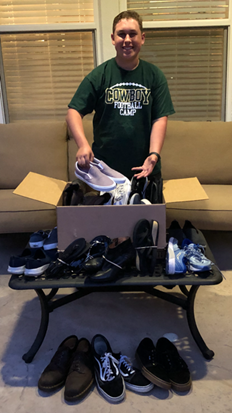 Freshman, Anthony Santos, collecting shoes for Soles4Souls.