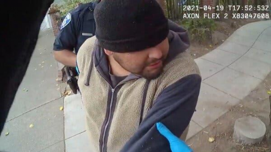The picture from a body cam video shows officers struggling to detain Mr. Gonzalez.