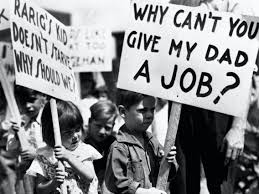 Children carry picket signs at a demonstration for the Workers Alliance during the Great Depression.