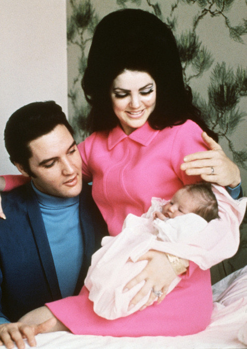 Elvis and Priscilla Presley preparing to leave the hospital with their daughter Lisa Marie.