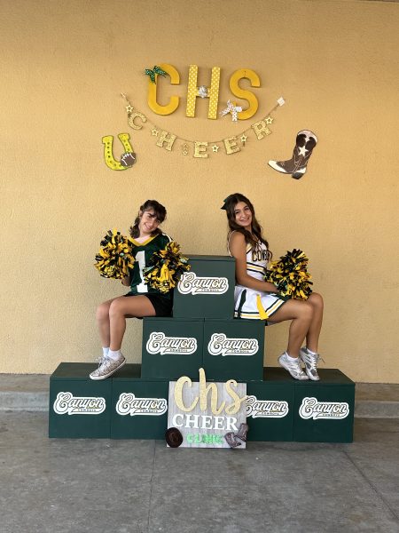 Varisty Cheerleader with Future Canyon Cheerleader at the cheer clinic!!