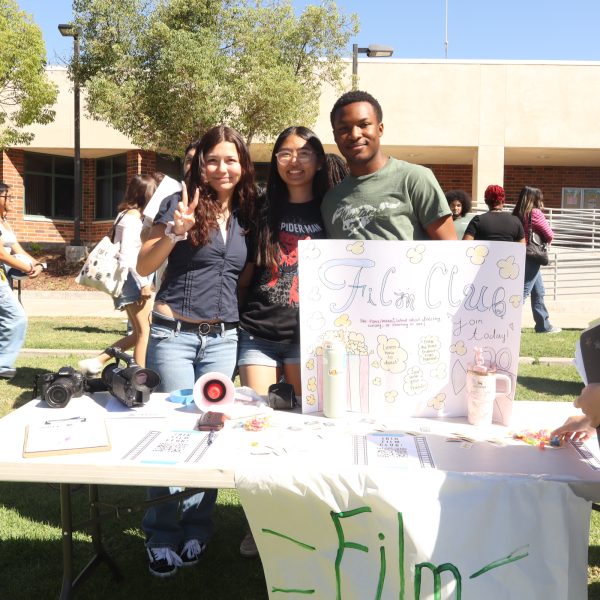 Film Club's booth with members Madelyn Martinez, Amelia Sivaborvorn, and Josh Ighodaro