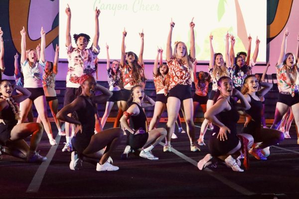 Canyon Cheer hitting their final pose of their bikers vs. surfers routine!