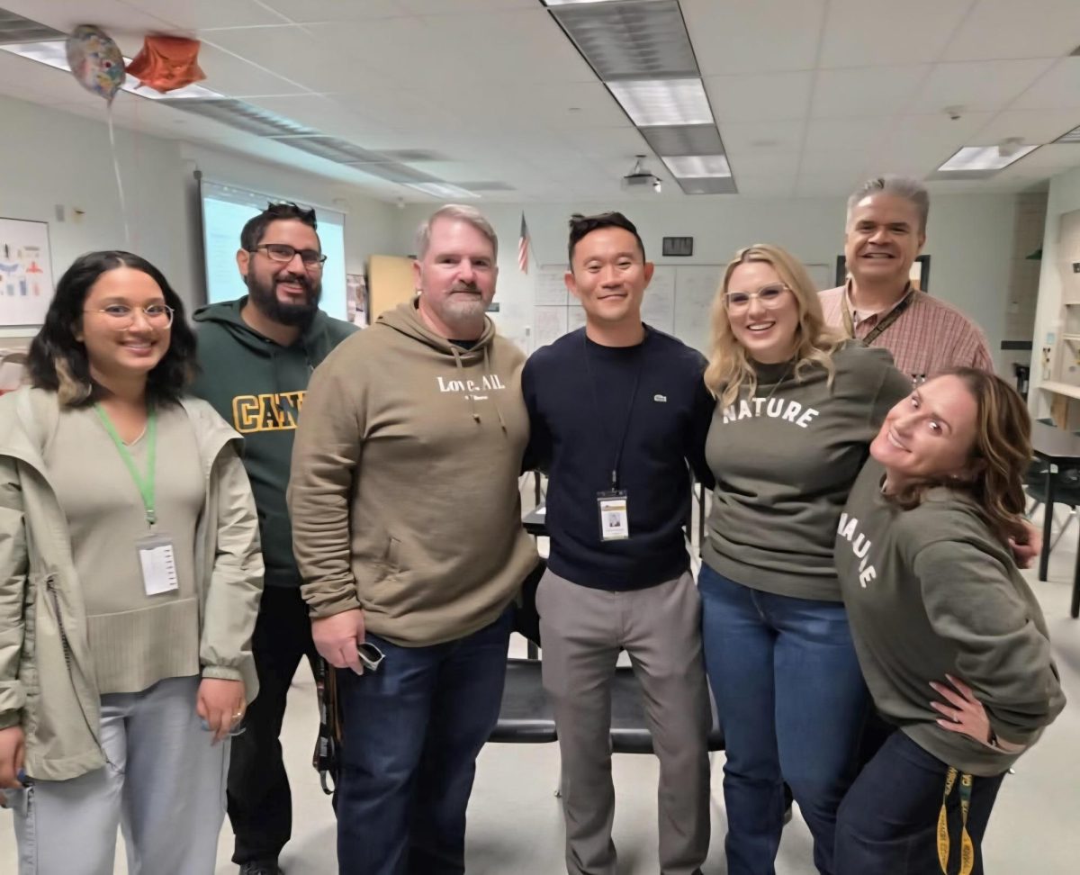 The staff in the science department posing for a photo together with Mr. Yong.